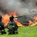 Firefighters watch as a small structure is engulfed in flames during a training exercise and controlled burn in 6700 block of Warner Rd. in Pittsfield Township on Thursday, May 9, 2013. Melanie Maxwell I AnnArbor.com